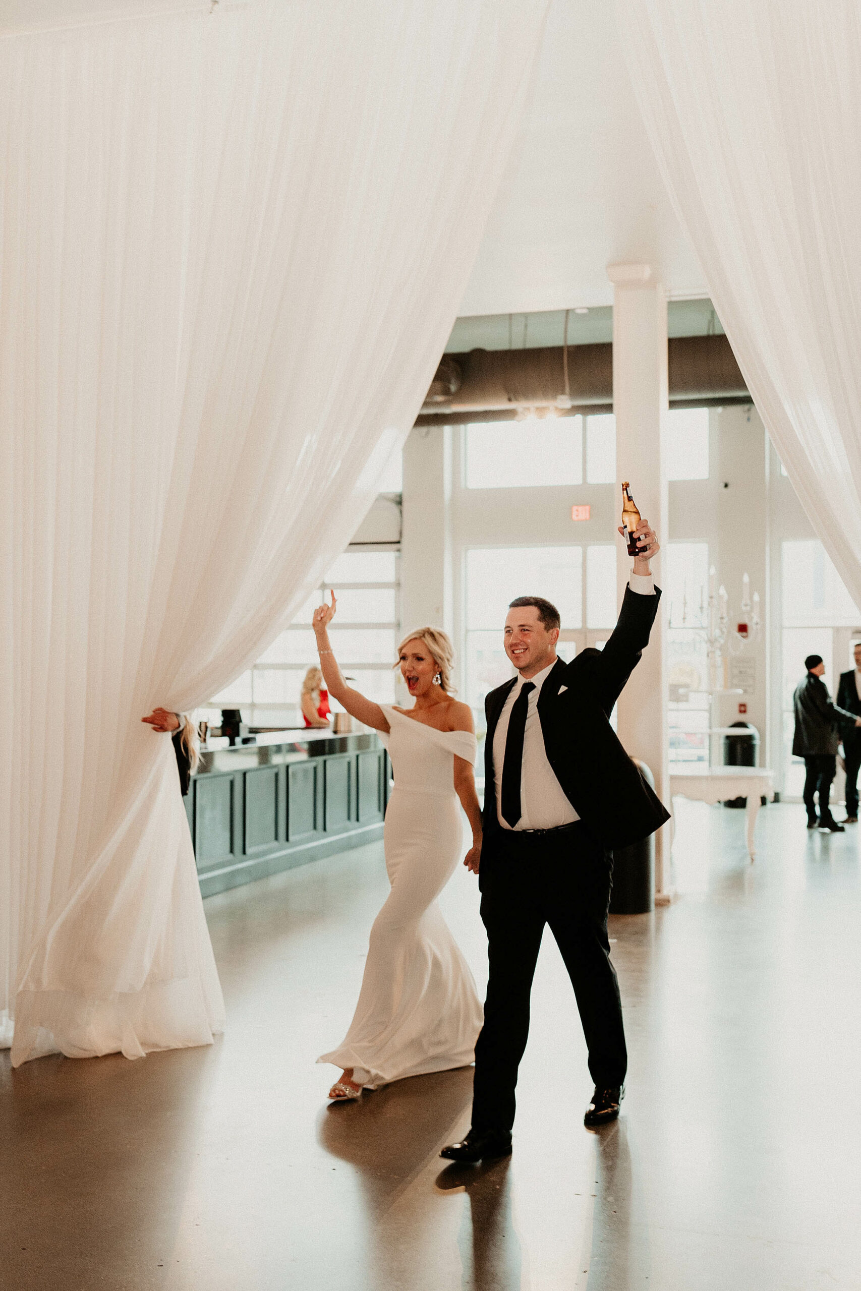 Bride and groom being introduced into the reception hall awesome wedding shot in Omaha